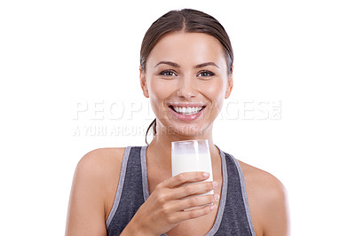 Buy stock photo Woman, portrait and glass of milk in studio for wellness, calcium and bone health with happiness or mockup space. Athlete, person or face with smile for nutrition or dairy product on white background