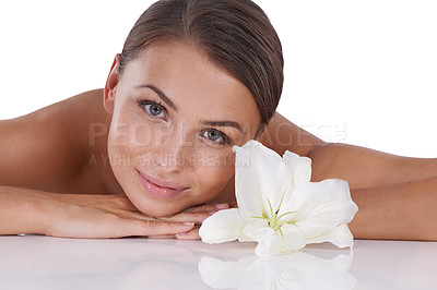 Buy stock photo Lily, skincare and portrait of woman in studio for shine, sustainable aesthetics and pure dermatology on white background. Face, model or flowers for natural beauty, blossom or eco friendly cosmetics