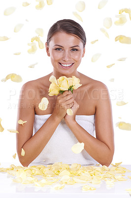 Buy stock photo Happy woman, portrait and yellow flowers in skincare, beauty or spa treatment on a white studio background. Face of female person, brunette or model smile with plant, roses or petals for soft skin