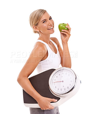 Buy stock photo Woman, apple and carrying scale for diet, weight loss or healthy nutrition against a white background. Portrait of happy isolated female with smile for organic, vitamins and dieting food for measure