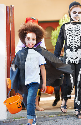 Buy stock photo Portrait, halloween and smile with children walking in costume for trick or treat celebration together. Kids, neighborhood and candy with group of friends on street for holiday or vacation tradition