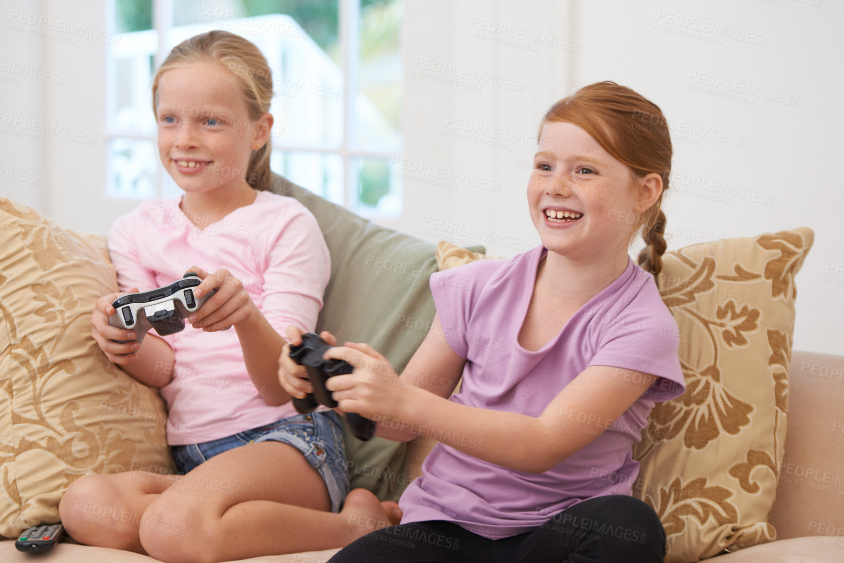 Buy stock photo Home, controller or happy kids gaming to play online with joystick on couch or sofa in living room. Children, fun experience or young girl gamers with smile for video games, contest or technology