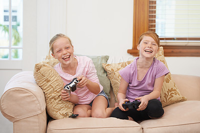 Buy stock photo Laughing, controller or happy kids gaming to play online with joystick on couch or sofa in living room. Children, young or funny girl gamers with smile for video games, contest or experience in home