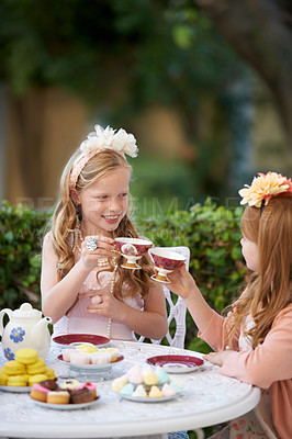 Buy stock photo Tea, party and girl children with toast, playing with fine china for celebration and fun in backyard. Relax, spring with cake or dessert, beverage or drink with friends outdoor in garden and cheers