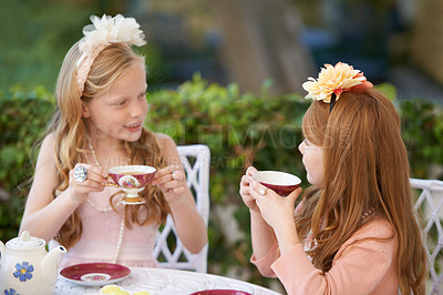 Buy stock photo Tea, party and girl children outdoor, playing with fine china for celebration and fun in backyard. Relax, spring and young kids in garden together, friends talking with beverage or drink for bonding