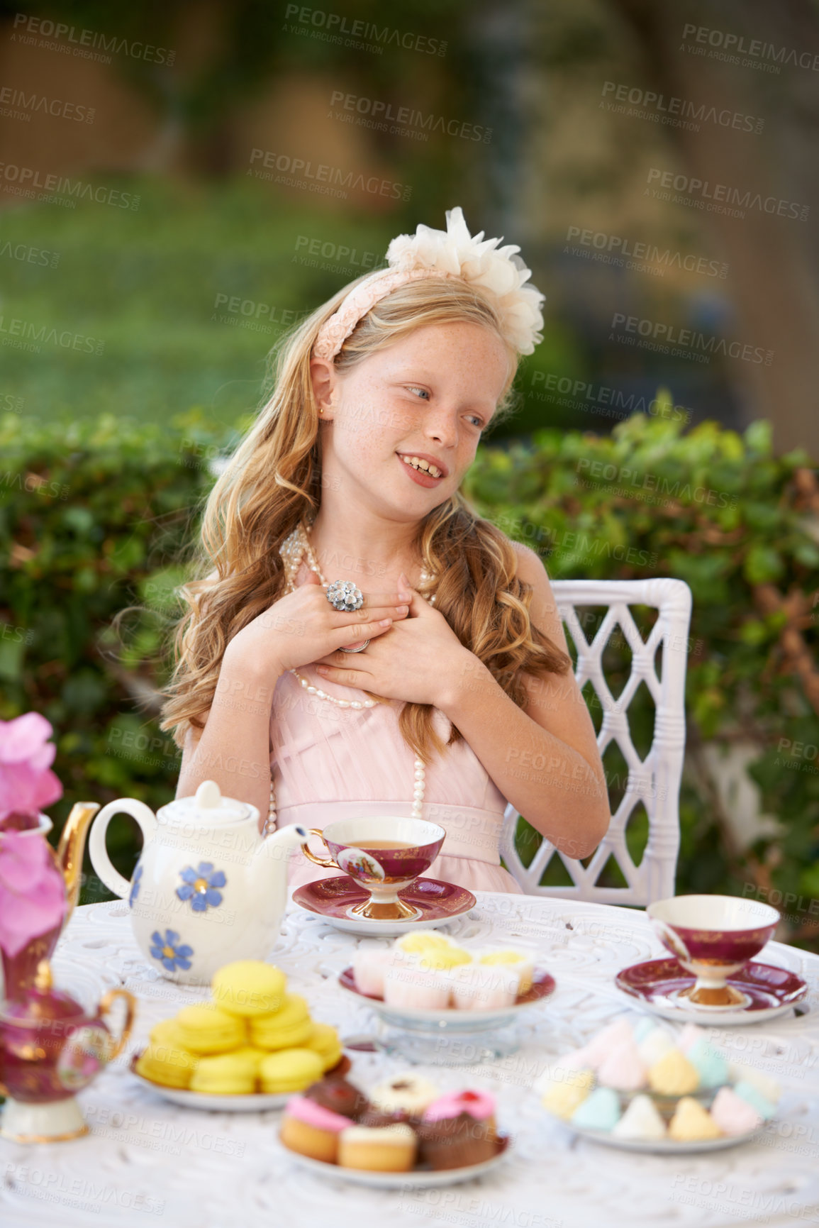 Buy stock photo Girl, child and happy at tea party in garden with face for birthday, celebration and playing outdoor in home. Person, kid and porcelain cups in backyard of house with dress up, beverage and role play