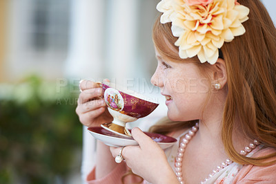 Buy stock photo Girl, child and happy with tea in garden with party for birthday, celebration and playing outdoor in home. Person, kid and porcelain cup in backyard of house with dress up, beverage and role play fun
