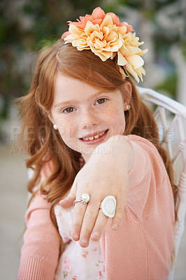 Buy stock photo Girl, child and portrait or hand ring or fantasy game play for dress up fancy, birthday party or event. Female person, face and fingers for stylish jewelry or kid confidence in costume, outfit or fun
