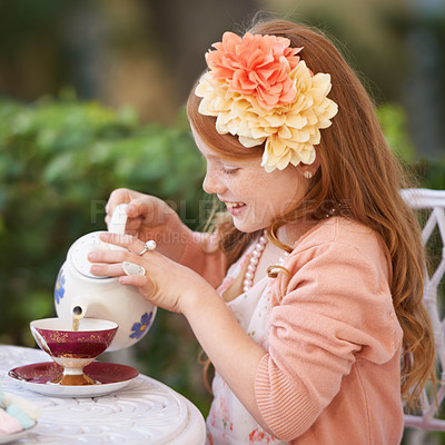 Buy stock photo Girl, child and tea party or outdoor play for fantasy fancy game for snack, birthday or beverage. Kid, youth and smile in backyard with cup for warm drink fr summer dress up, flowers or preschool
