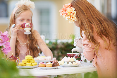 Buy stock photo Girls, children and friends at tea party in nature for fantasy play for cake, birthday or game. Kids, food and fancy dress up or flower crown or outdoor for summer bonding, backyard or macarons