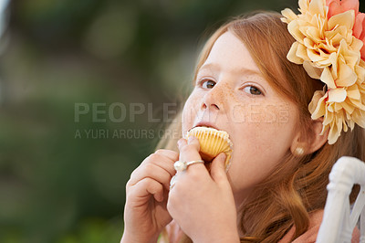 Buy stock photo Child, girl and eating cupcake or sweets for happy or birthday food or celebration, dessert or candy. Female person, kid and sweet snack at garden event or hungry outdoor for treat meal, party or fun