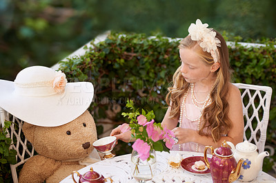 Buy stock photo Children, tea party and girl in a garden for playing, fun and fantasy with toys, teddy bear or drink. Kid, childhood and elegant, fancy or creative celebration, games or birthday theme in a backyard