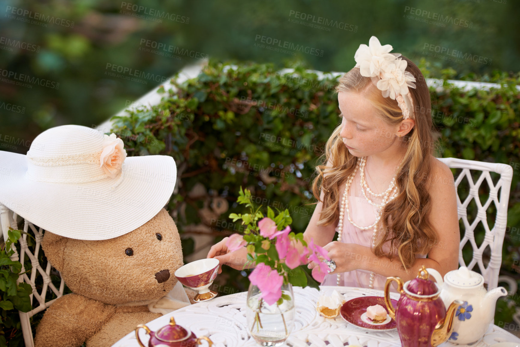 Buy stock photo Children, tea party and girl in a garden for playing, fun and fantasy with toys, teddy bear or drink. Kid, childhood and elegant, fancy or creative celebration, games or birthday theme in a backyard