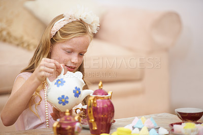 Buy stock photo Girl, tea pot and party in home for birthday celebration fun or sweet dessert for dress up fancy game, play or snack. Female person, child and candy food in living room for holiday, event or lunch