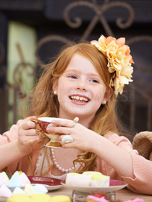 Buy stock photo Girl, child and face by tea party in garden for birthday, celebration and playing outdoor in home. Person, kid and porcelain cup in backyard of house with dress up, beverage and princess role play