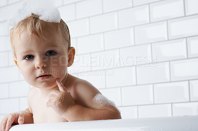 Buy stock photo Portrait of baby in bath with soap, bubbles and cleaning on mockup in morning for hygiene, wellness or care in home. Toddler washing in foam with face, relax and face of calm child in tub in bathroom