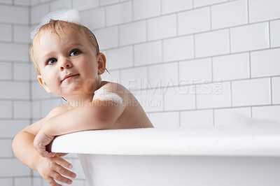 Buy stock photo Kid, baby and child in bath, tub and foam for cleaning, skincare or healthy morning routine at home. Toddler boy, thinking and washing for wellness with soap, bubbles or water for hygiene in bathroom