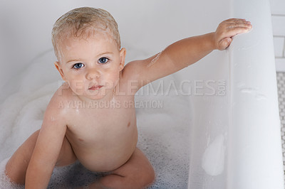 Buy stock photo Portrait, baby and kid in bath, tub and cleaning with water for soft skincare, morning routine and healthy wellness at home. Cute toddler, boy child and washing for hygiene, soap and foam in bathroom