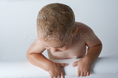 Buy stock photo Child, baby and boy in bathtub of water for morning routine, skincare and wellness at home on white background. Wet kid cleaning with soap, foam and bubbles for washing, hygiene or mockup in bathroom