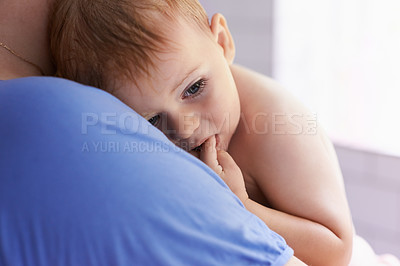 Buy stock photo Parent, comfort and holding baby with calm, sleepy or tired in home with support and care. Person, love and carry child in arms bonding with kindness in bedroom and infant with trust in family