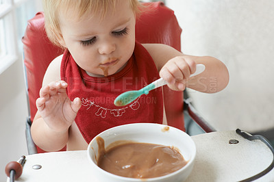 Buy stock photo High chair meal, baby and eating spoon in a house with diet, nutrition and child, wellness or  development. Food, messy eater and boy kid curious about breakfast cereal, playing or learning at home