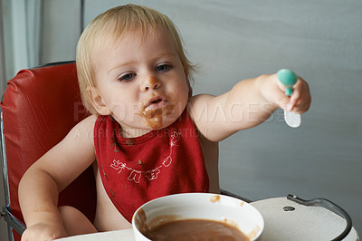 Buy stock photo Feeding chair, eating and baby with spoon in a house for food, nutrition and fun while playing. Food, messy eater and boy kid at home with meal for child development, diet or nutrition while learning
