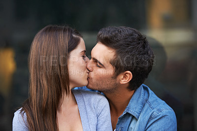 Buy stock photo Love, kiss and a young couple outdoor for care, commitment and people in connection. Romance, man and woman touch lips together for bonding, trust in relationship and affection on valentines day date