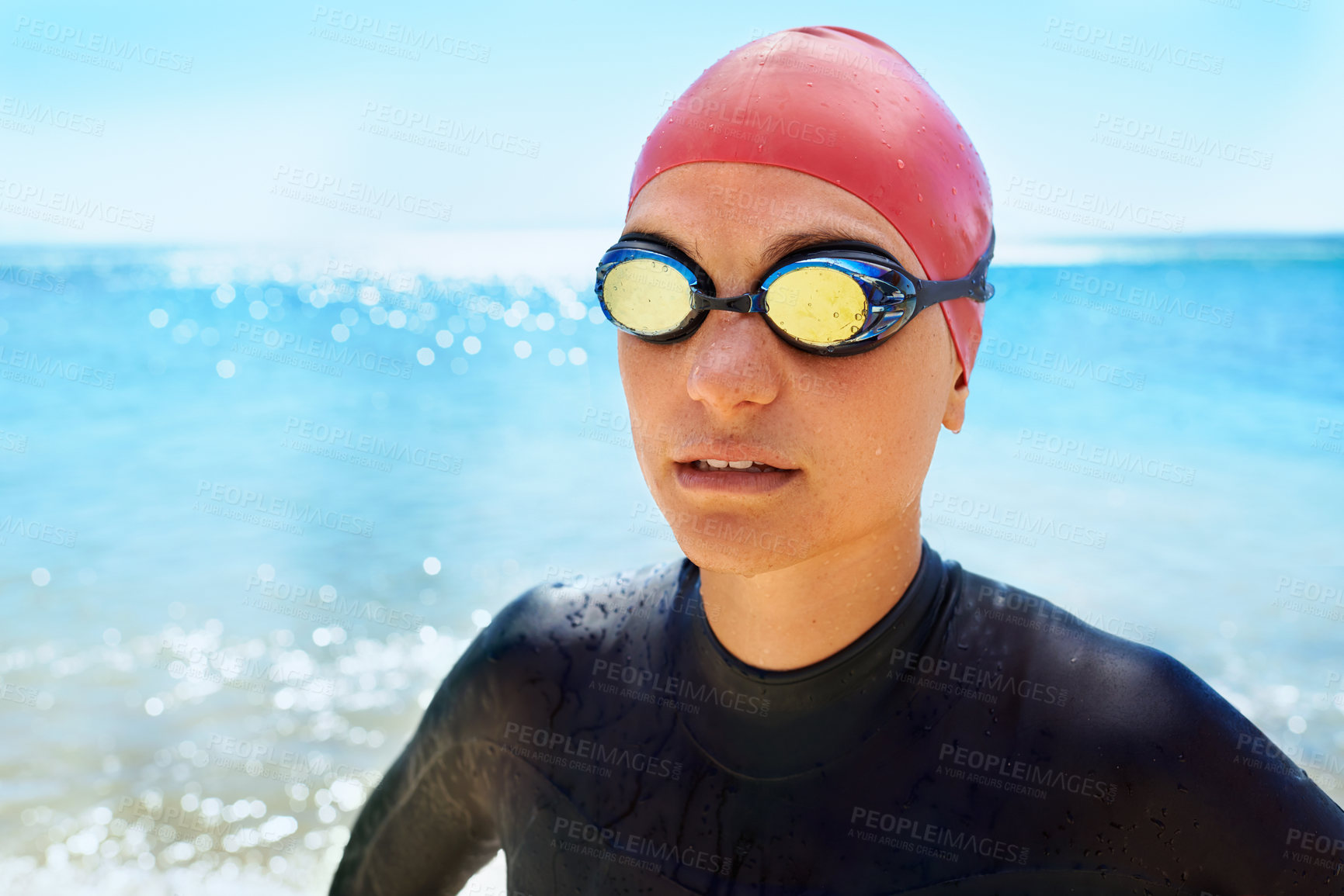 Buy stock photo Sports, goggles and woman swimming at the beach with blue sky for triathlon, race or competition training. Female Swimmer, athlete or person in ocean or sea for fitness workout or exercise for health