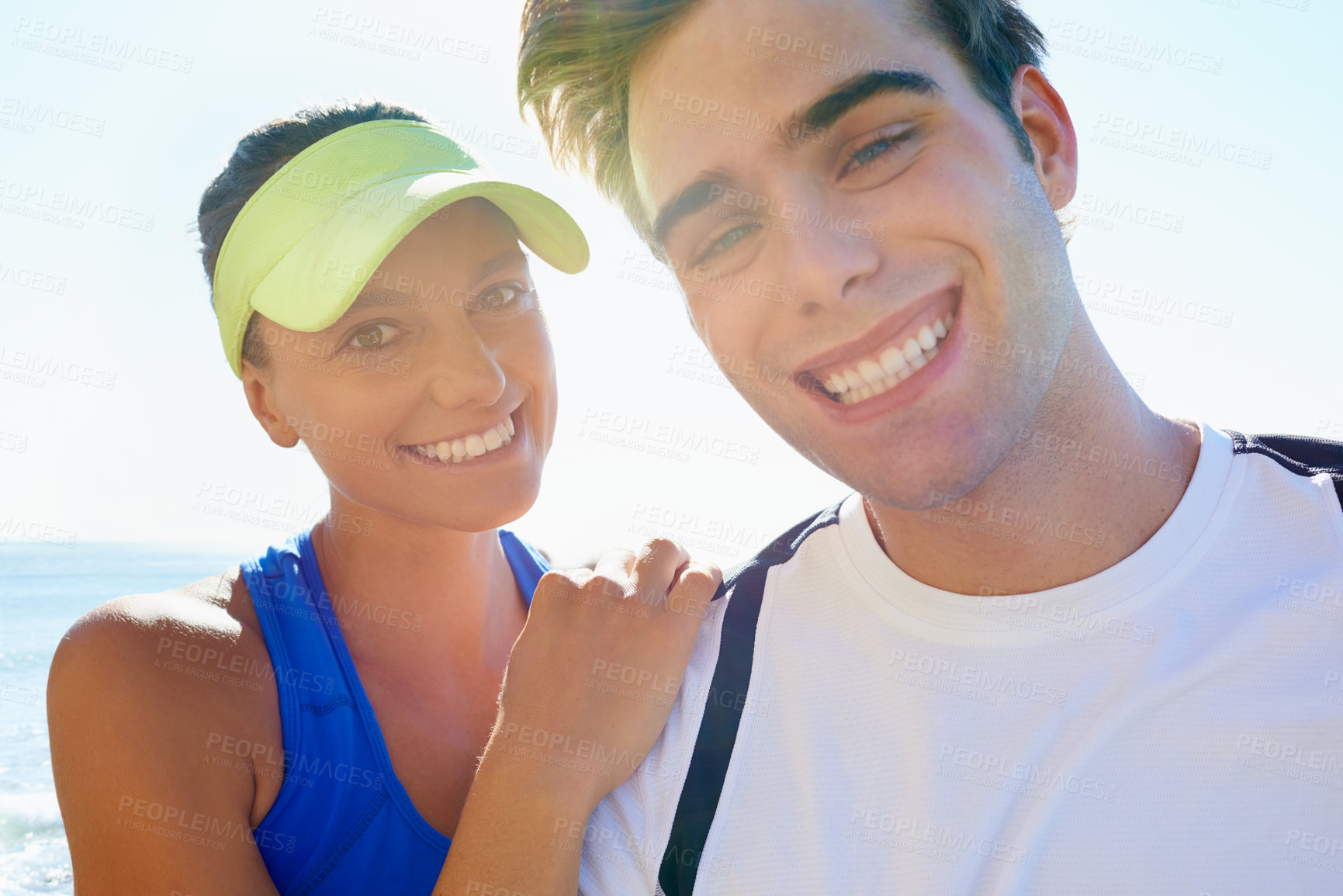 Buy stock photo Couple, outdoor and portrait in beach front, exercise and fitness with smile, training and sunrise for run. Man, woman and athletic for ocean, sea and ready together in summer, happy and workout