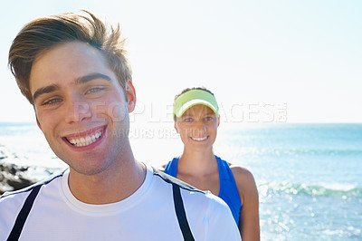 Buy stock photo Happy couple, runners and portrait in beach, workout and fitness with smile, training and outdoor for run. Man, woman and athletic in ocean, sea and exercise together in summer, morning and young