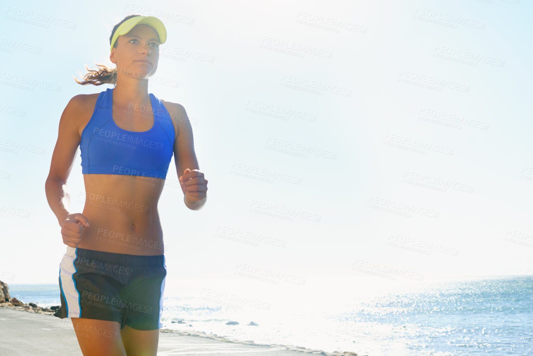 Buy stock photo Fitness, beach and young woman running for race, competition or marathon training exercise. Sports, health and female athlete runner with cardio workout for endurance and speed by ocean or sea.