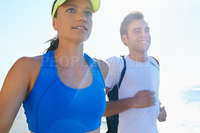 Buy stock photo Couple, running and fitness in beach, workout and active with smile, training and sunrise for run. Man, woman and athletic for ocean, sea and exercise together in summer, boyfriend and girlfriend
