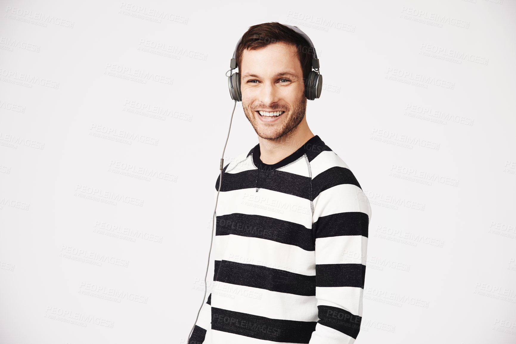 Buy stock photo Man, portrait and headphones with music and podcast with happiness and listening. Isolated, white background and male person hearing web audio and song streaming with a happy smile in studio