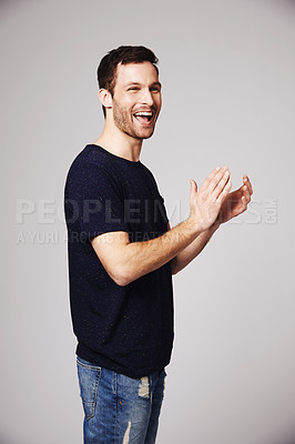 Buy stock photo Winner, celebration and man clapping with success in studio for good news, winning and achievement. Celebrate, happy and excited male person on white background for victory, announcement and cheering