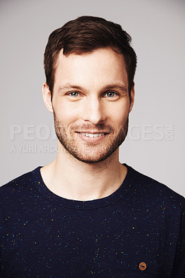 Buy stock photo Man, portrait and smile of a happy person with confidence and casual style in a studio. Isolated, gray background and face of a male model and young person with modern fashion and stylish clothes