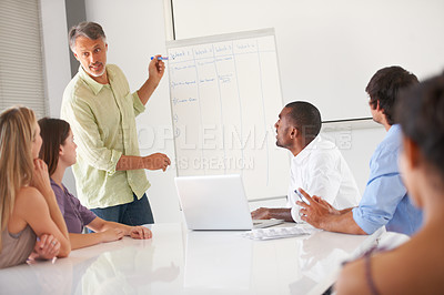 Buy stock photo Businesspeople listening to a presentation