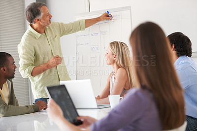Buy stock photo Businesspeople listening to a presentation