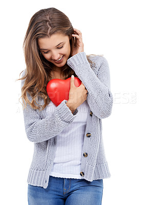 Buy stock photo Red heart, smile and shy woman in studio for love, care and romance, affection or support on white background. Shape, flirt and female model with symbol, sign or icon for valentines day celebration