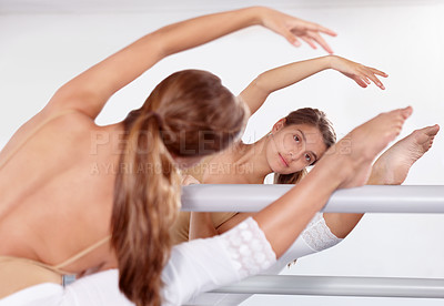 Buy stock photo Reflection, ballerina and stretching legs on barre in classroom, practice and student exercise. Ballet, flexibility and girl on mirror training, dance choreography for art or performance for fitness