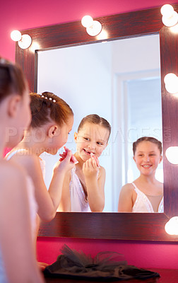Buy stock photo Children, backstage and dancer in mirror with makeup for theatre, performance and excited for ballet. Students, behind the scenes or reflection of girl in frame with lipstick, cosmetics or production