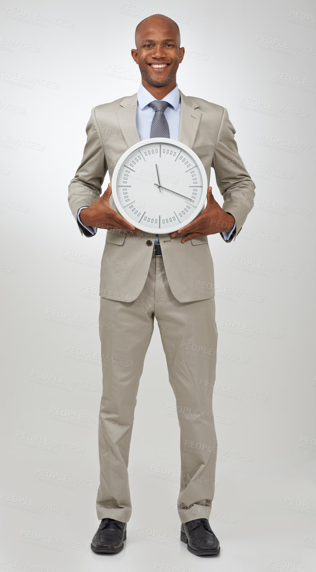 Buy stock photo Businessman, portrait and clock time for deadline as professional lawyer for schedule, hurry or punctual. Black person, face and white background in studio for company job efficient, hour or mockup