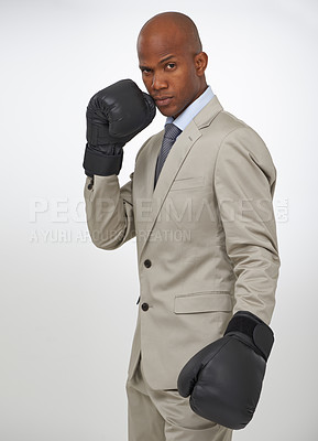 Buy stock photo Boxing gloves, studio portrait and black man, business fighter or attorney fight injustice or government law. Battle, boxer and person for legal defence, protection or challenge on white background