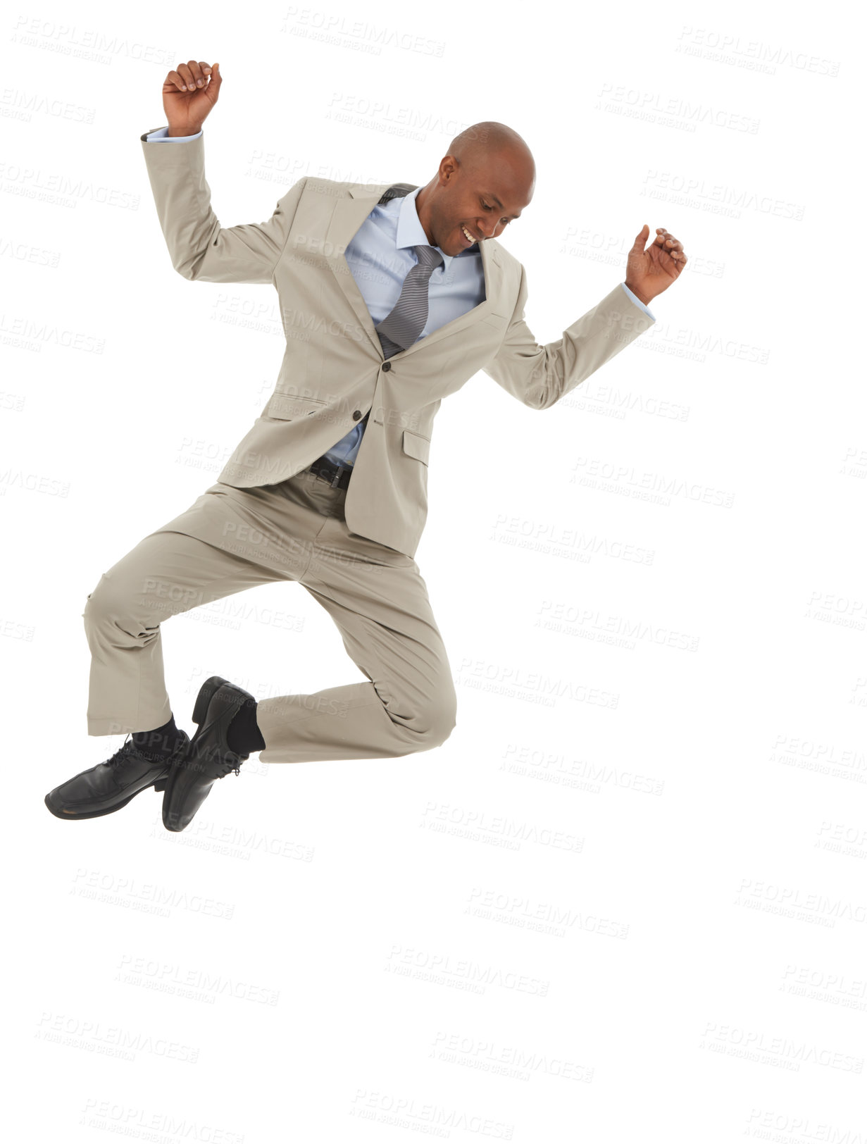 Buy stock photo An African-American businessman jumping joyfully in the air