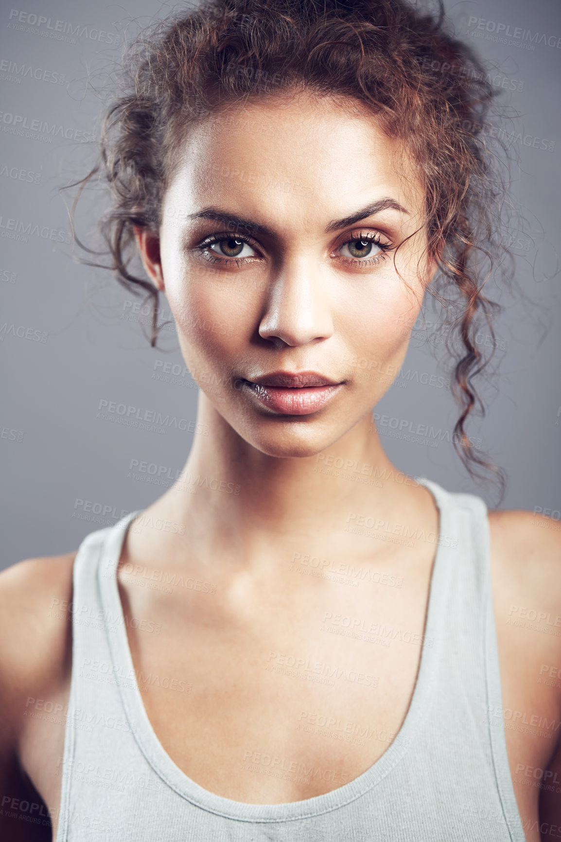 Buy stock photo Studio shot of a gorgeous young woman posing against a gray background