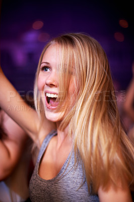 Buy stock photo Woman, dancing and music festival, happy and party in nightclub, celebrating and dj event. Disco, rock and freedom with girl dancer in crowd of fans for celebration, energy and techno performance