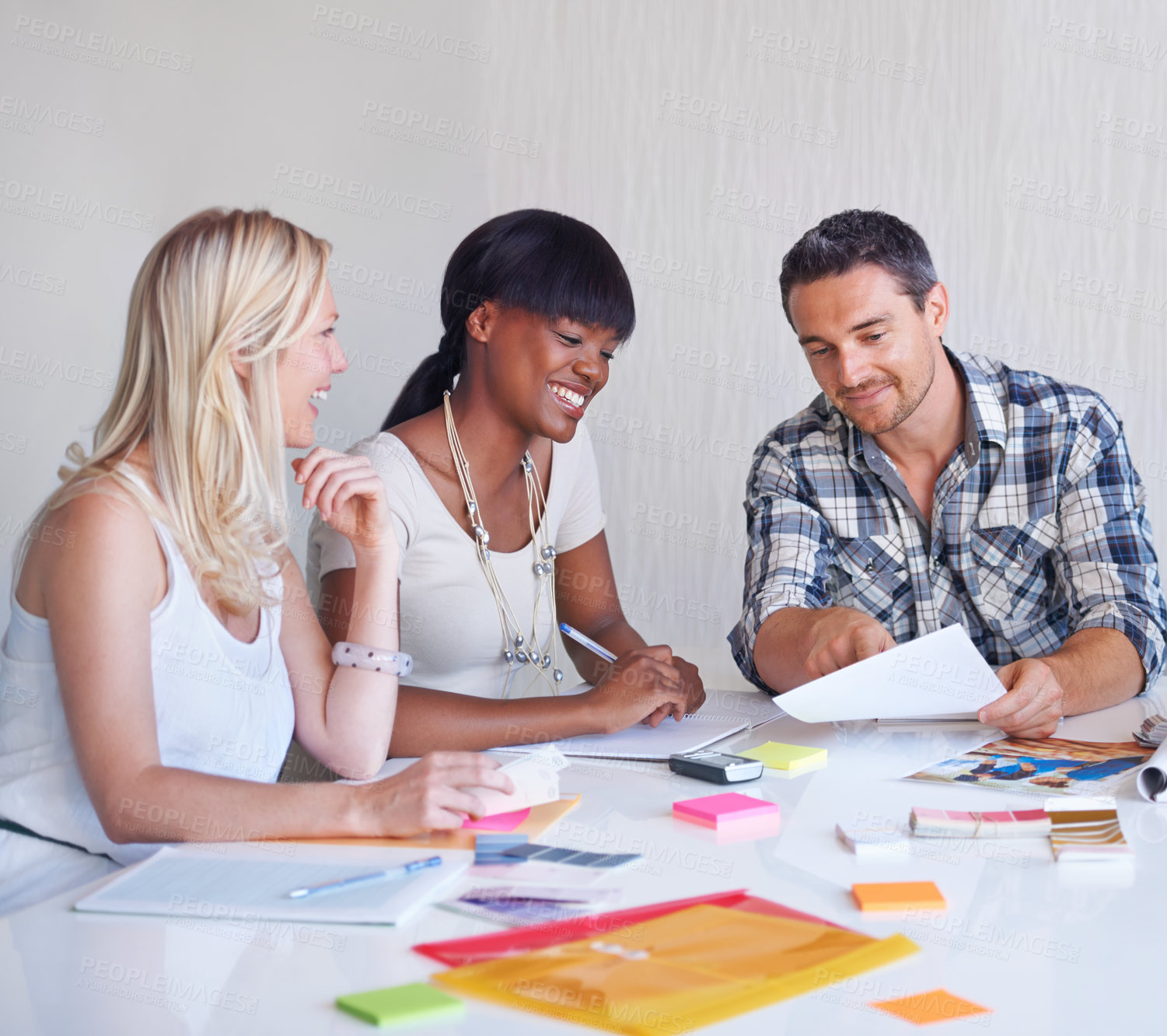 Buy stock photo Brainstorming, smile and team of business people with photograph at table in meeting together, cooperation or collaboration in startup. Happy, creative group or designers on picture planning strategy