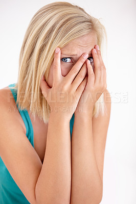 Buy stock photo Terror, portrait and woman with hands on face, scared and confused with trauma in horror studio. Panic, scary danger and shocked embarrassed girl with stress, anxiety and fear on white background.