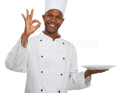 Buy stock photo Portrait, chef and ok sign with plate presentation in studio isolated on white background. Smile, cooking or okay hand gesture of African man, show empty dish or restaurant success with perfect emoji