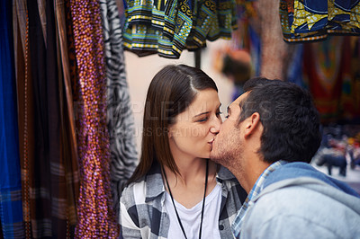 Buy stock photo Outdoor, kissing and couple with love, date and happiness with honeymoon vacation, romance and relationship. Marketplace, man and woman with marriage, bonding together and holiday with joy or embrace