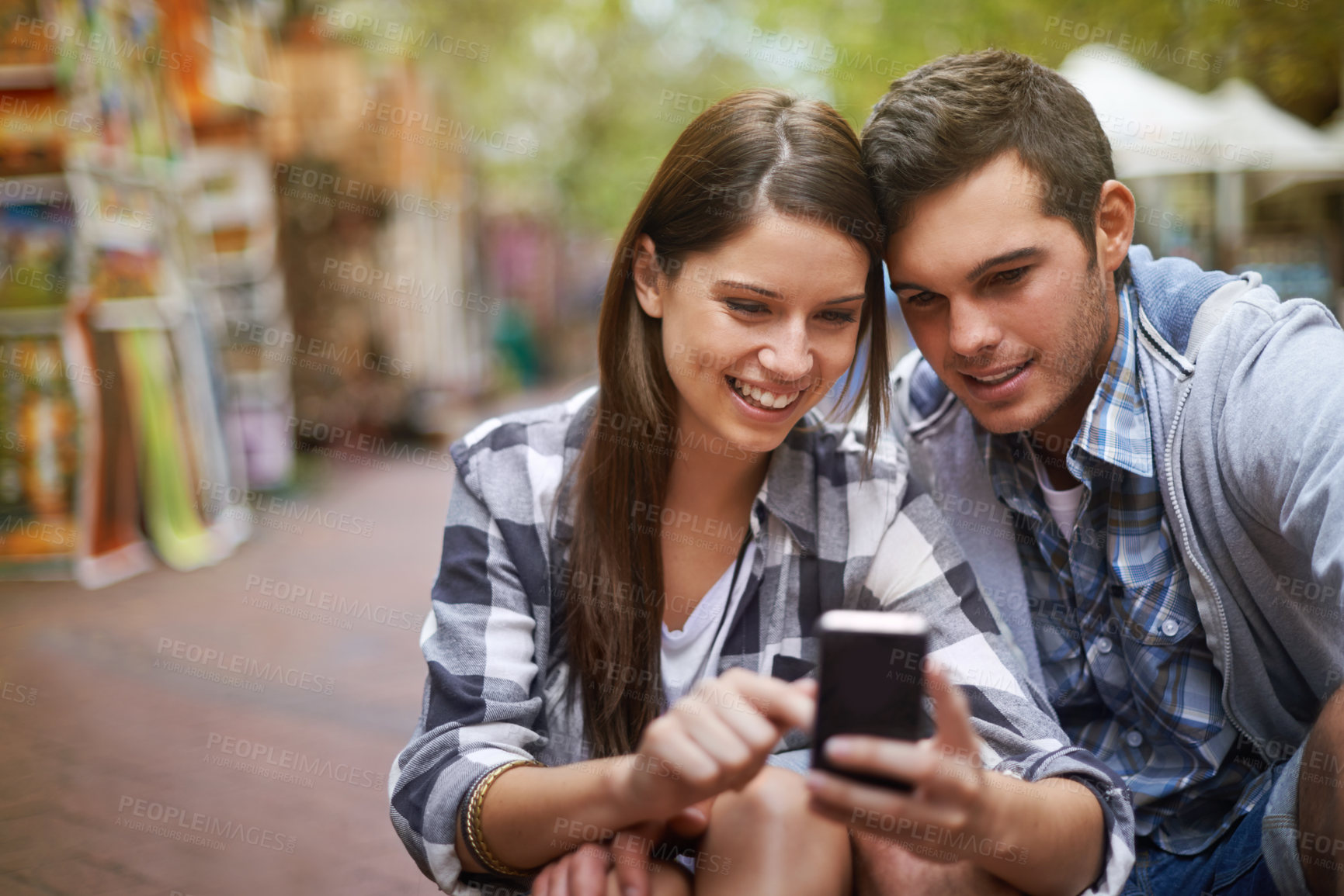 Buy stock photo City, smile and couple with a cellphone, internet and social media with texting, digital app or meme. New York, man or woman with a smartphone, mobile user or connection with network, joy or marriage